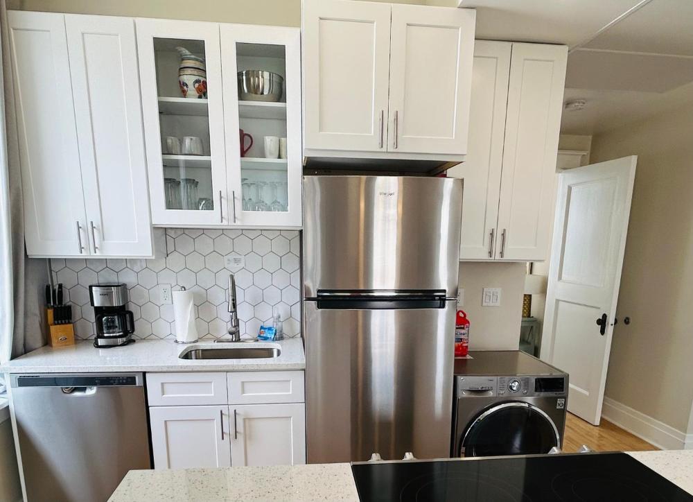 Downtown Digs-View of the City! Stay above local restaurants and nightlife, posh amenities heated toilet seat, oversized rain shower head in glass shower, in-unit laundry, one garage parking spot